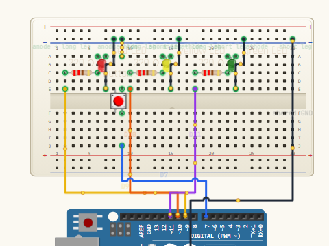 Breadboard view. Three LEDs on D9, D10 and D11 through 220 ohm resistors, plus an INPUT_PULLUP button on D7, all sharing the minus rail as a ground bus