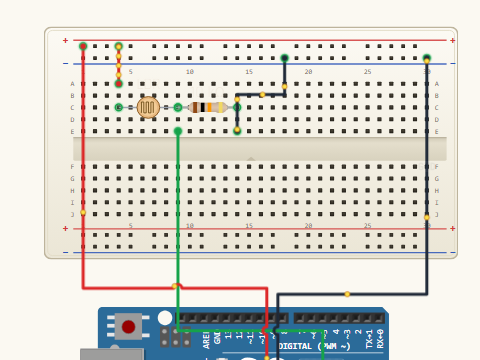 Breadboard view. An LDR and a 10 kilohm resistor in series between 5 V and ground, with A0 reading the joint