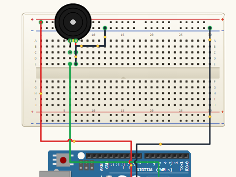 Breadboard view. A piezo disc across A0 and ground with a 1 megohm resistor in parallel with it