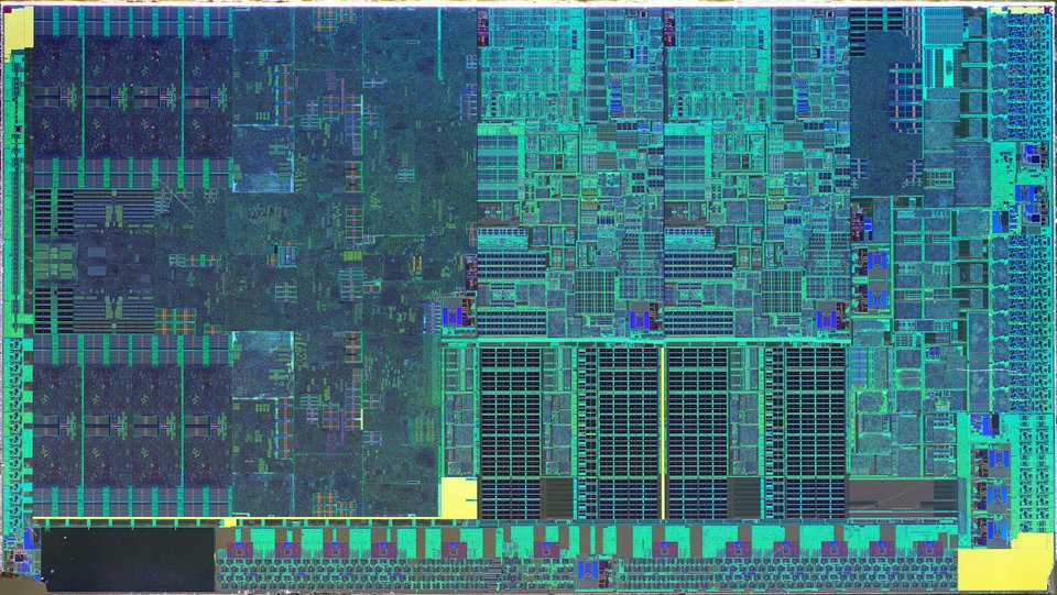 A colour-enhanced microscope photograph of a processor chip, showing repeated rectangular blocks of circuitry