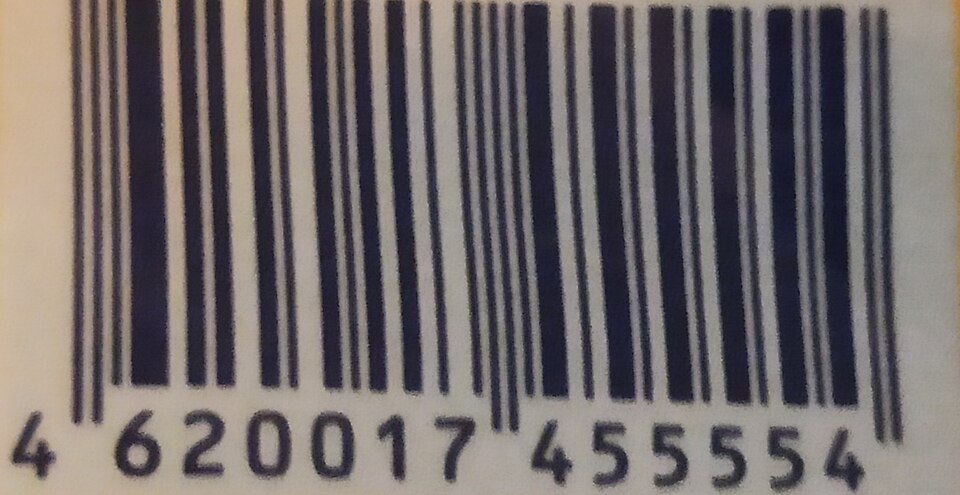Close-up of a thirteen-digit barcode printed on a food packet, with the digits printed underneath