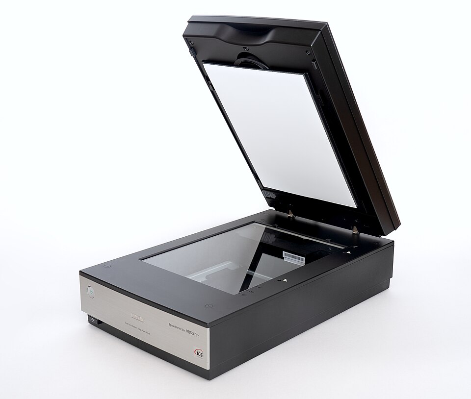 A flatbed scanner with its lid raised, showing the glass panel where a document is placed