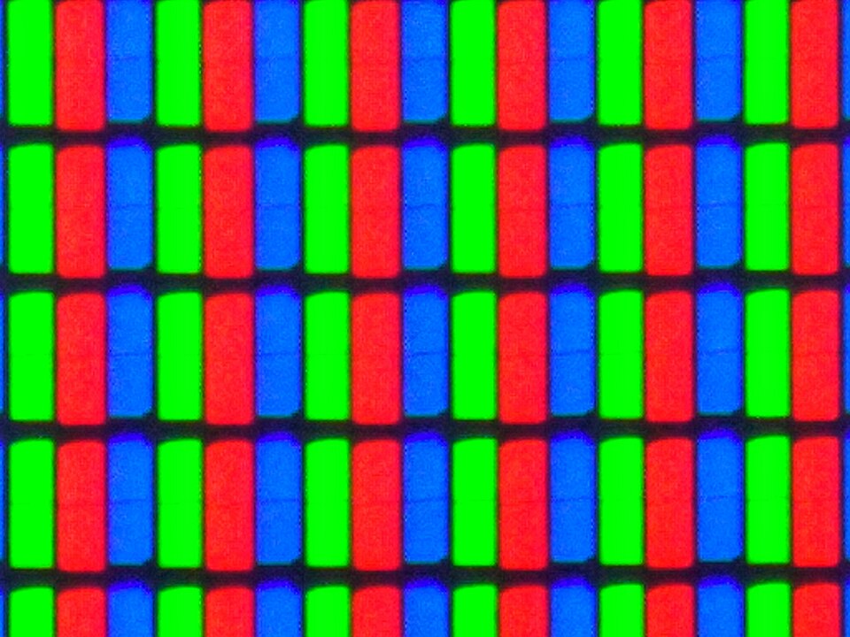 Extreme close-up of a TV screen showing columns of red, green and blue sub-pixels