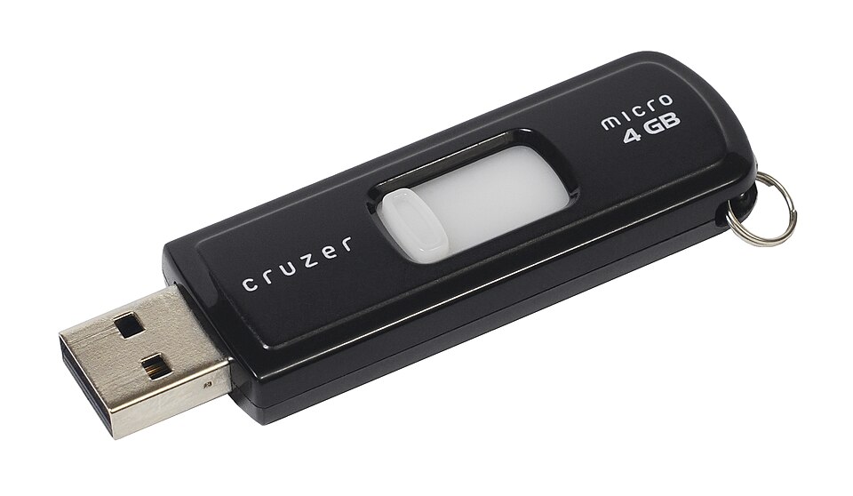 A black USB flash memory stick with its connector out