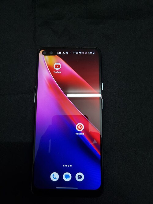 A smartphone home screen showing app icons on a touch screen