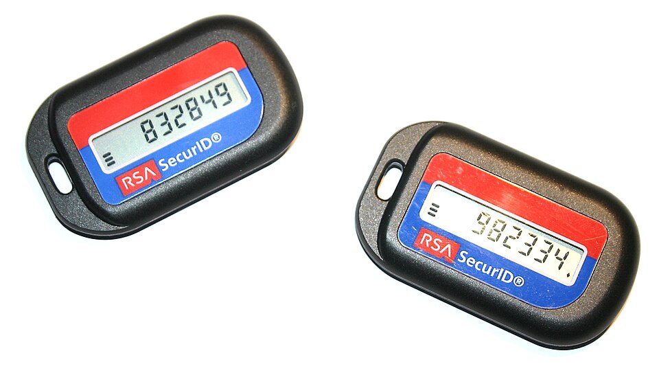 Two small key-fob security tokens, each showing a six-digit one-time code on its screen