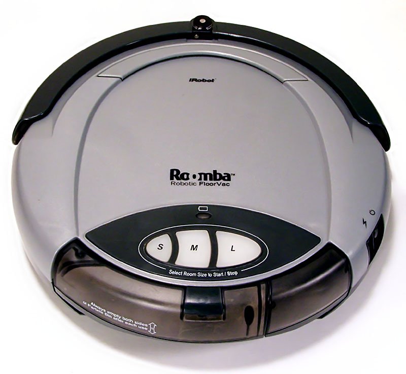 A round, grey robot vacuum cleaner seen from above
