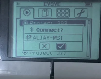 The EV3 Brick screen showing a Connect? dialog naming the computer ALJAY-MSI, with a cross and a tick to choose between.