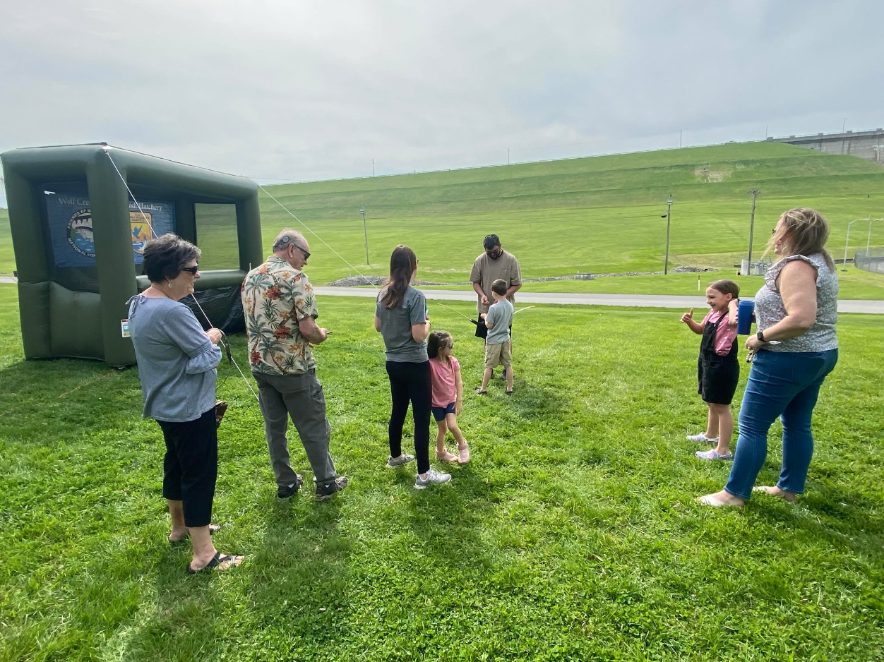 Archers shooting at targets on an outdoor range.